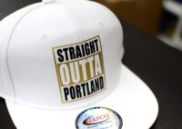 A hat with Straight Outta Portland on it.