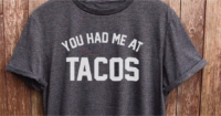 A shirt with a vinyl You Had Me At Tacos print on it